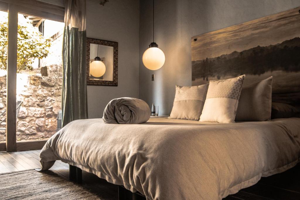Postel nebo postele na pokoji v ubytování Hotel Dios