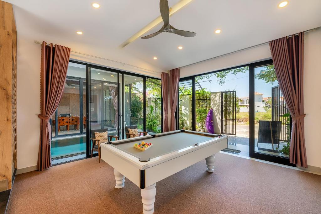 a billiard room with a pool table at U Maison by Class6 in Hoi An