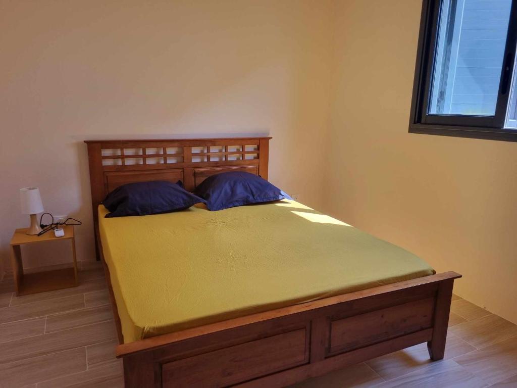 Postel nebo postele na pokoji v ubytování Ti kaz Palmiste