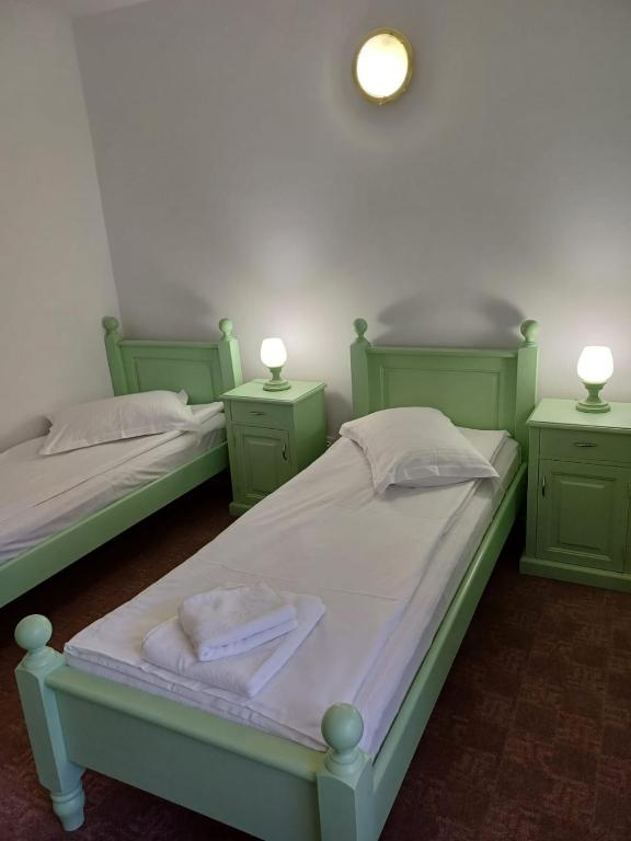 Postel nebo postele na pokoji v ubytování Hotel Hefaistos - Sovata