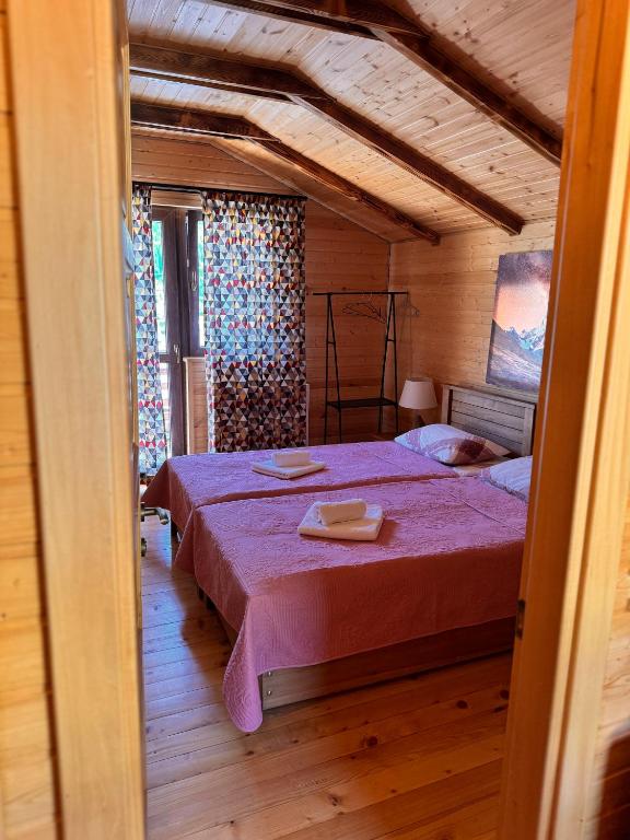 Postel nebo postele na pokoji v ubytování Villa Dabderr Mestia