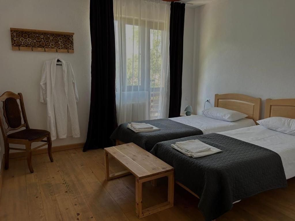 Postel nebo postele na pokoji v ubytování Beko’s garden Inn