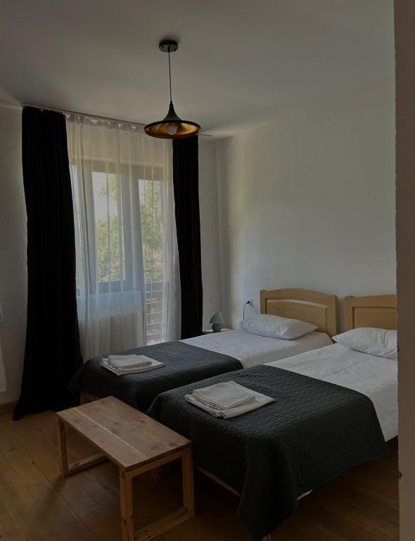 Postel nebo postele na pokoji v ubytování Beko’s garden Inn