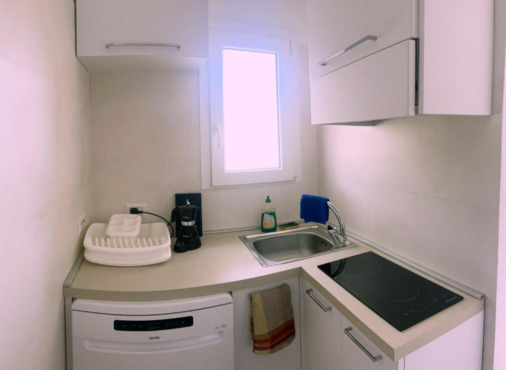 Kuchyň nebo kuchyňský kout v ubytování Villa Antioco