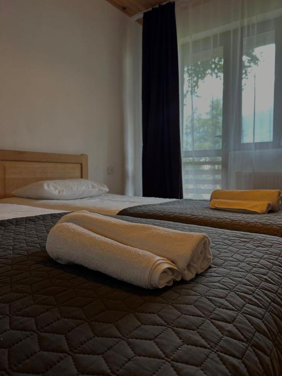 Postel nebo postele na pokoji v ubytování Beko’s garden Inn