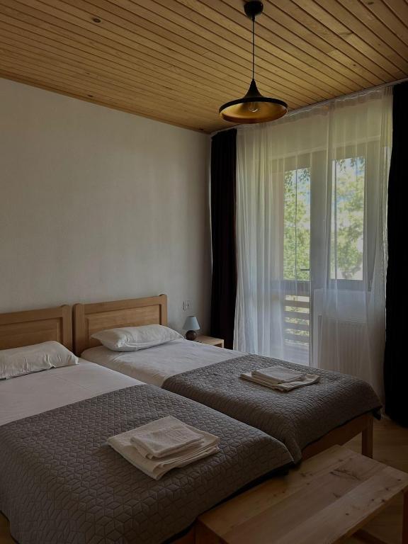 Postel nebo postele na pokoji v ubytování Beko’s garden Inn