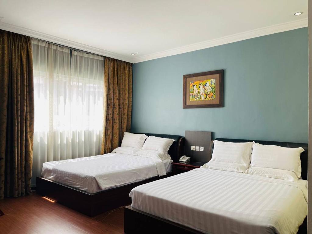 Postel nebo postele na pokoji v ubytování Penview Hotel