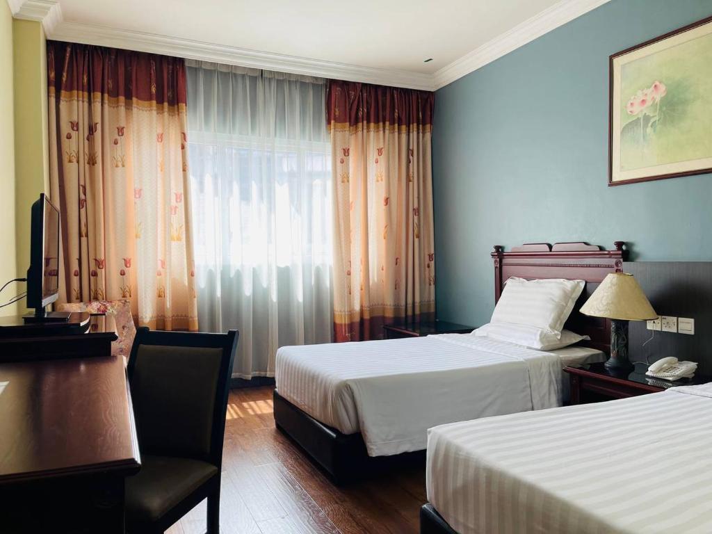 Postel nebo postele na pokoji v ubytování Penview Hotel