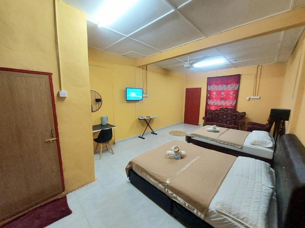 Postel nebo postele na pokoji v ubytování Irama Resort Amir YJS , Pantai Irama Bachok