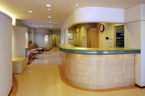 a lobby with a bar in a building at Business Hotel Prince in Takamatsu