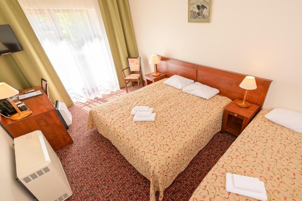 Postel nebo postele na pokoji v ubytování Regina