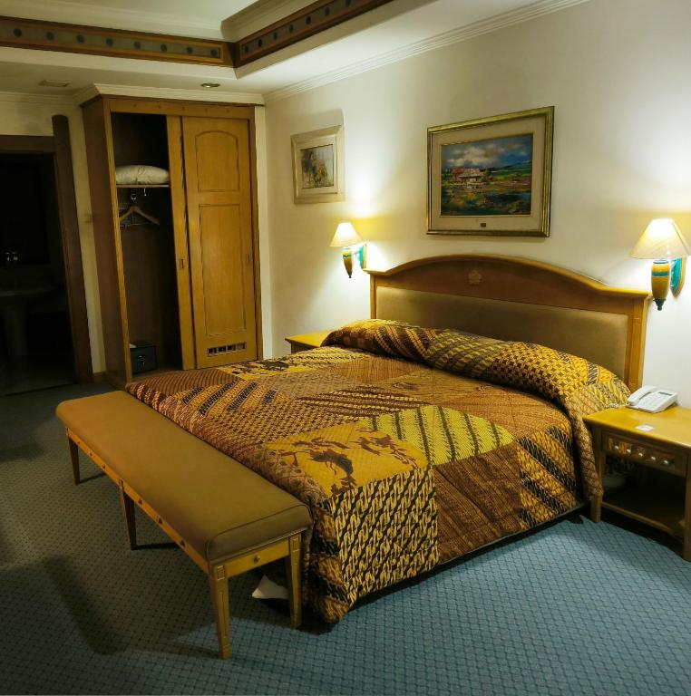 Voodi või voodid majutusasutuse Kresna Hotel toas