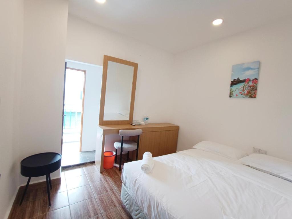 Postel nebo postele na pokoji v ubytování Shoreline Guesthouse 海岸线客栈