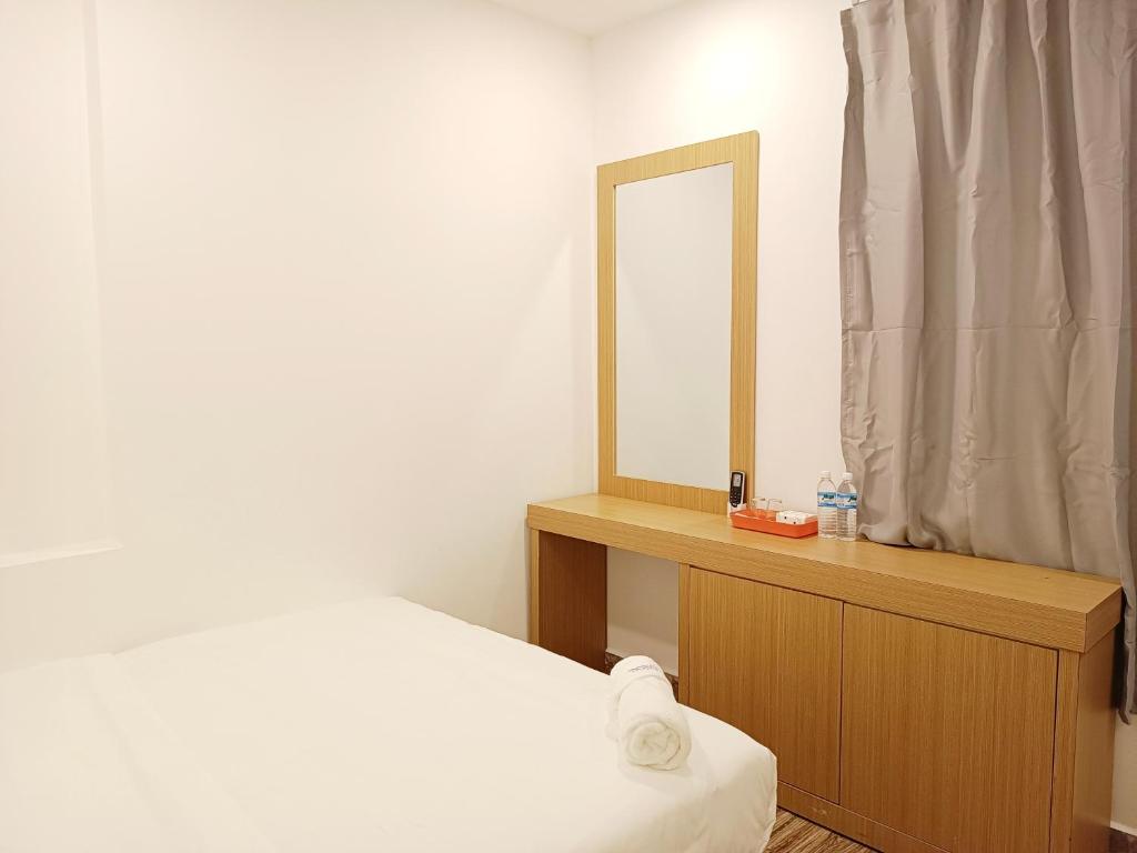 Postel nebo postele na pokoji v ubytování Shoreline Guesthouse 海岸线客栈
