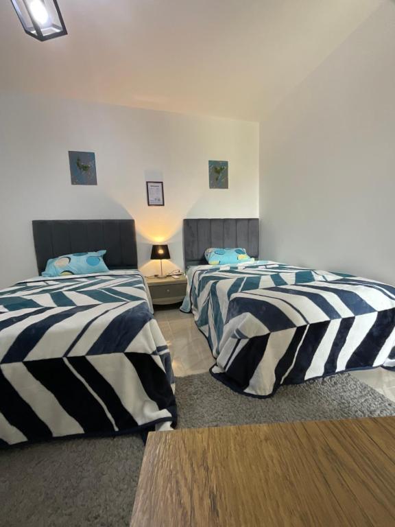 Postel nebo postele na pokoji v ubytování Madinaty B12 Shared Apartment With Private Rooms - One minute from Mall - غرفة خاصة في شقة مشتركة