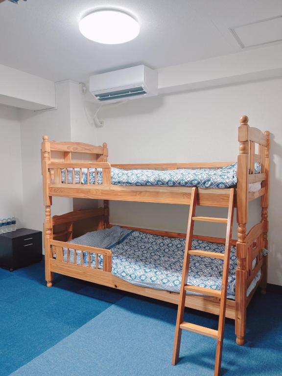 Postel nebo postele na pokoji v ubytování ひまわりHotel