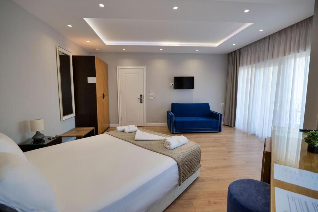 Postel nebo postele na pokoji v ubytování AMI MAR Hotel