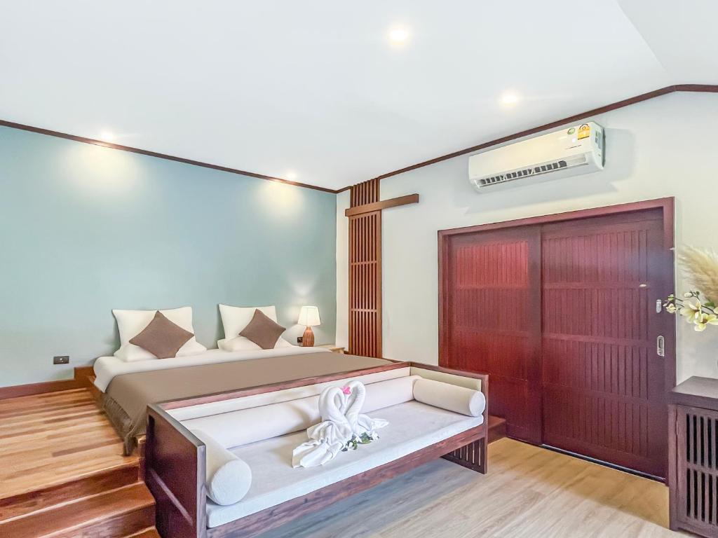 Postel nebo postele na pokoji v ubytování begonia N7 villa resort海棠7号别墅酒店