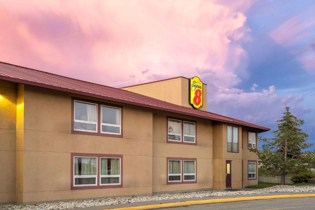 a building with a burger king sign on it at Super 8 by Wyndham Sherwood Park/Edmonton Area in Sherwood Park