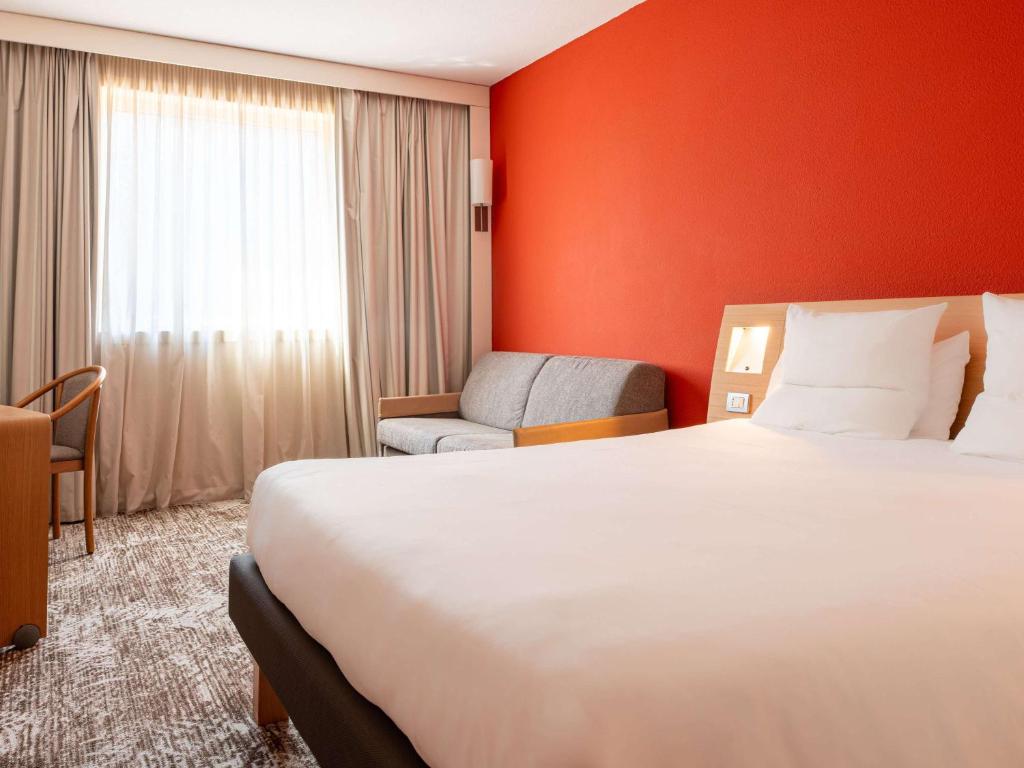 Postel nebo postele na pokoji v ubytování Novotel Roma Est