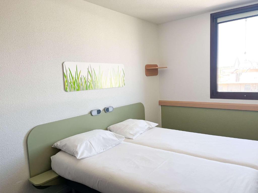 Letto o letti in una camera di ibis budget Nimes Centre Gare