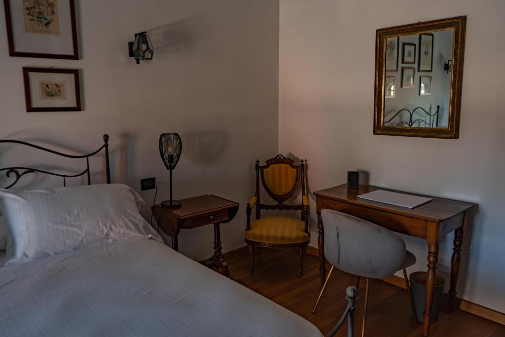 Postel nebo postele na pokoji v ubytování B&B Villa Argiolas