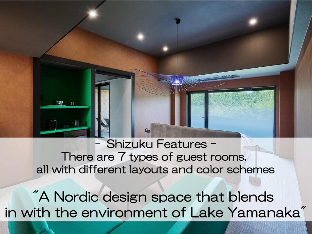a bedroom with a bed and a chandelier in a room at Mt Fuji View and Private Sauna Ryokan Shizuku in Yamanakako