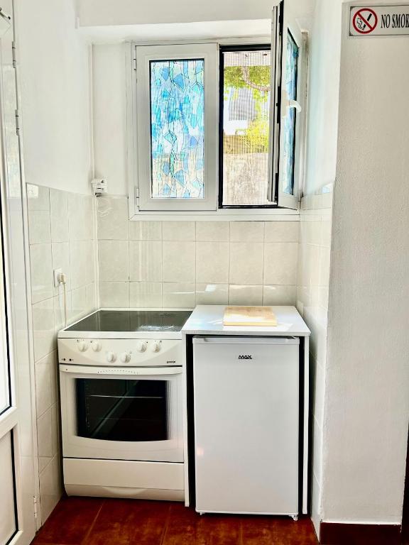 Kuchyň nebo kuchyňský kout v ubytování Apartments Jankovic