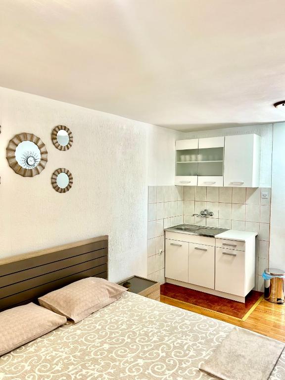 Kuchyň nebo kuchyňský kout v ubytování Apartments Jankovic