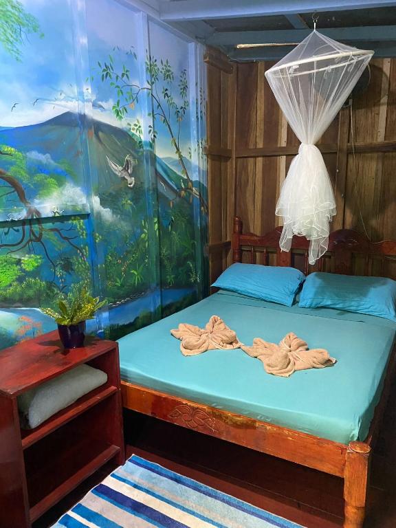 Postel nebo postele na pokoji v ubytování Hidden Jungle Beach House
