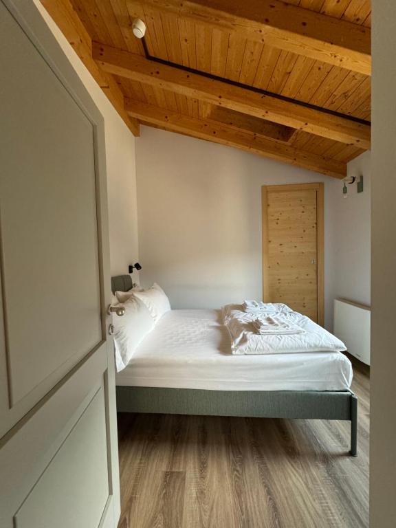 Postel nebo postele na pokoji v ubytování Locanda Via Priula