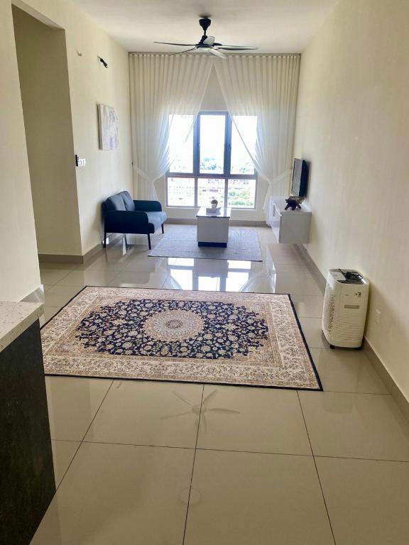 a living room with a rug on the floor at Tiny Sweet Home in Kajang