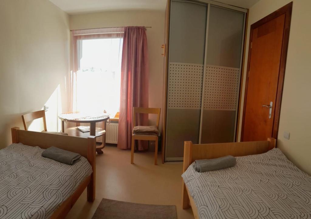 Postel nebo postele na pokoji v ubytování Hostel Jaunvaltes