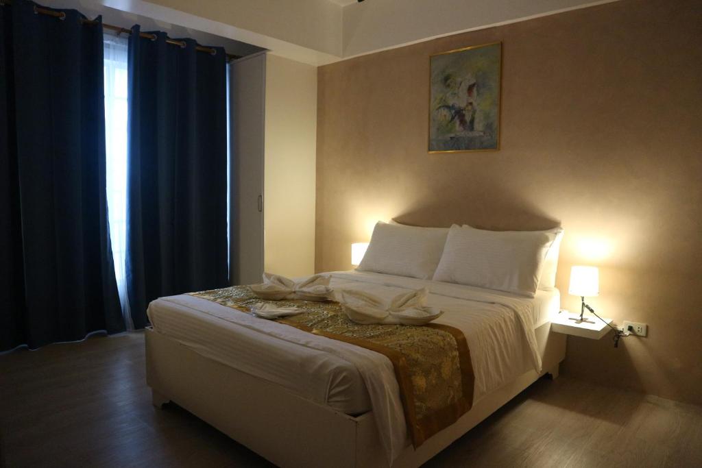 Postel nebo postele na pokoji v ubytování Hotel Casa Ilustre