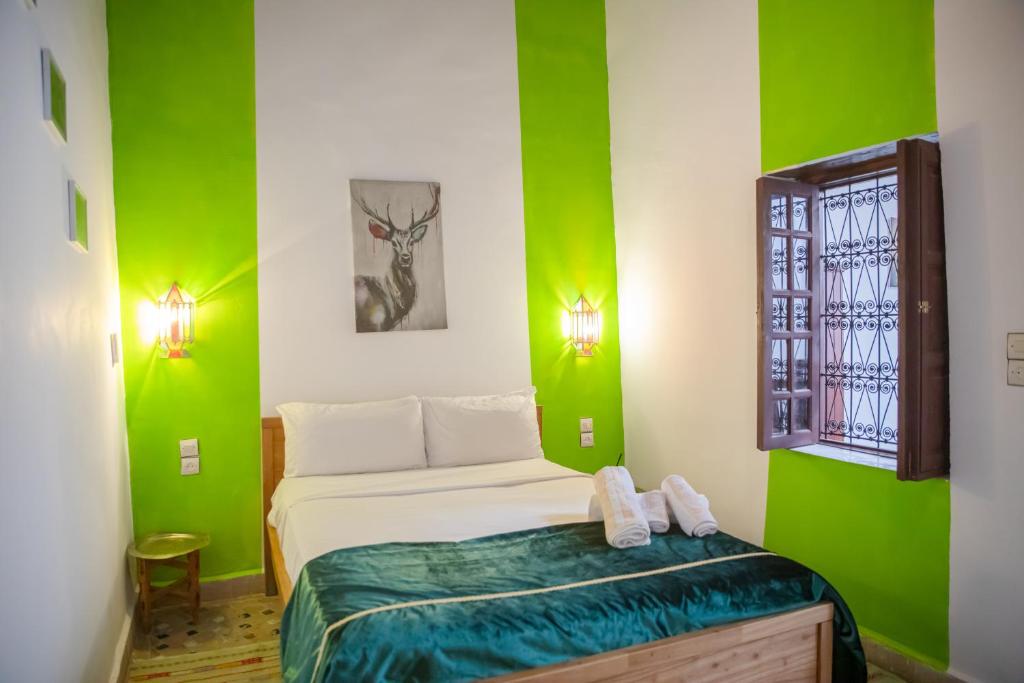 Postel nebo postele na pokoji v ubytování Riad Fes Dar
