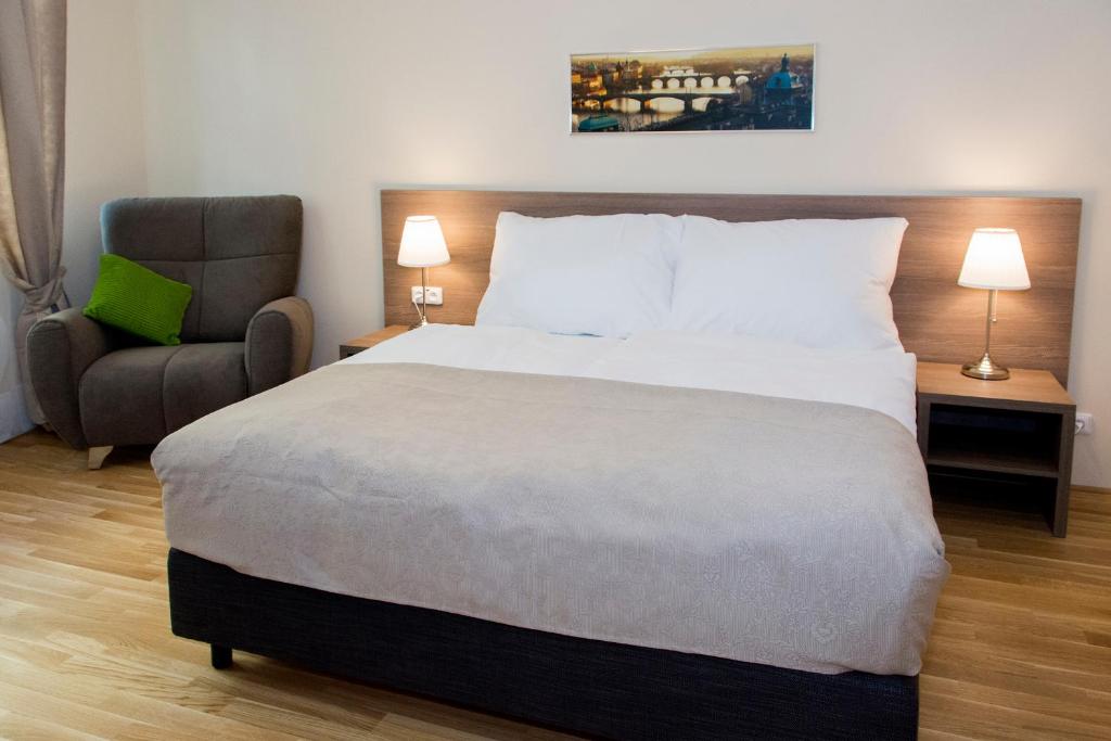 Postel nebo postele na pokoji v ubytování Limes Apartments
