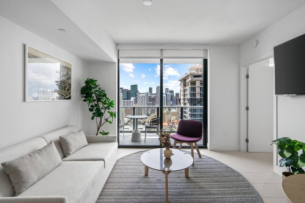 a living room with a couch and a table at New Luxury Apartment at Downtown Miami in Miami