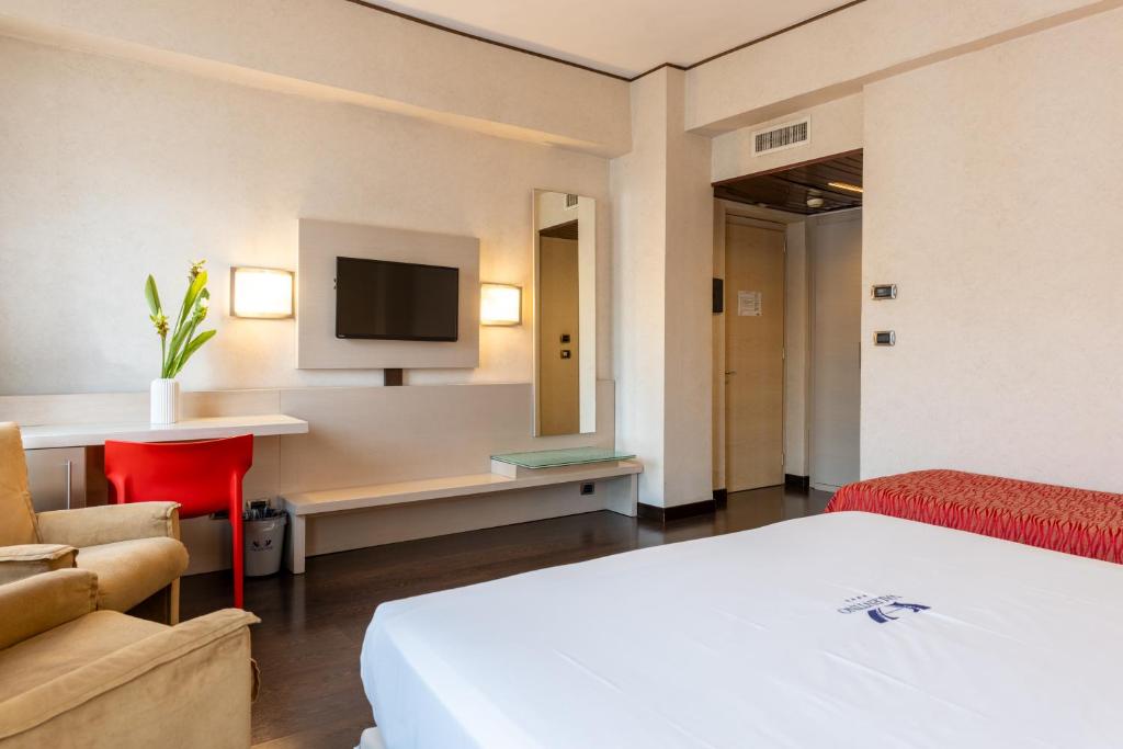 TV a/nebo společenská místnost v ubytování Hotel Valentino