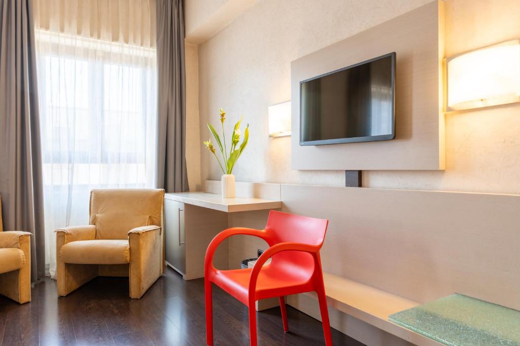 TV a/nebo společenská místnost v ubytování Hotel Valentino