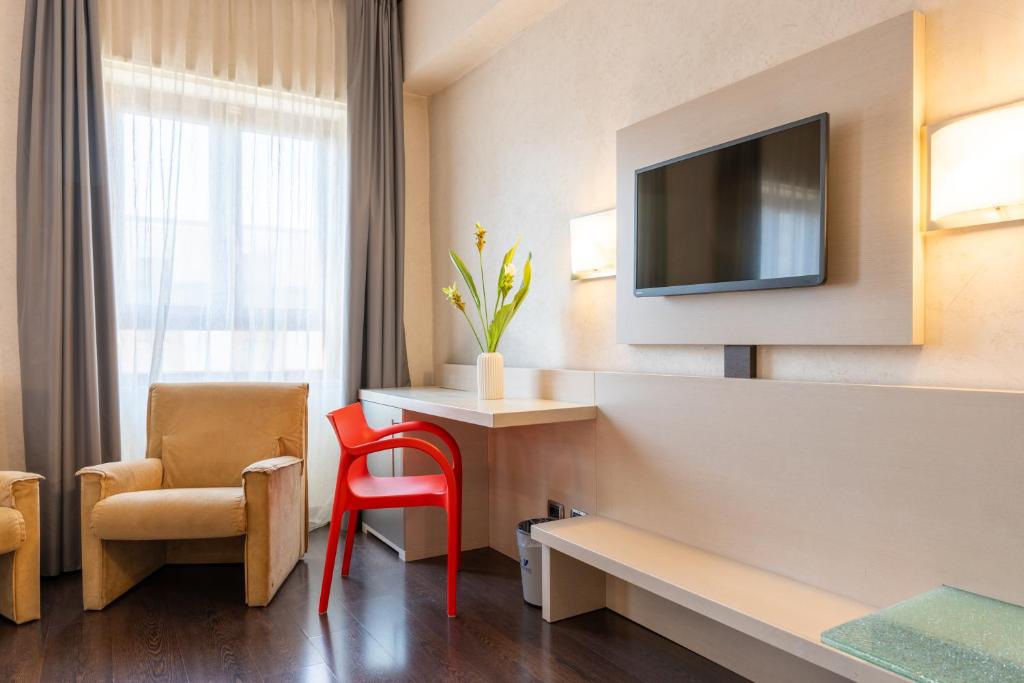 TV a/nebo společenská místnost v ubytování Hotel Valentino