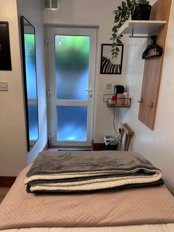 a bed in a room with a window at Malahide Guest Rooms in Malahide
