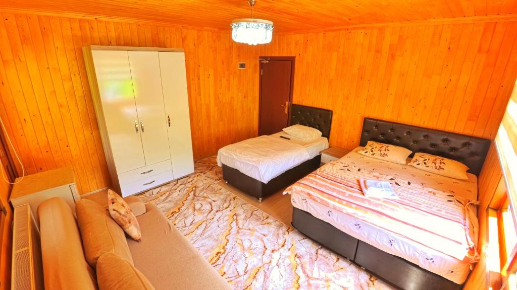 Postel nebo postele na pokoji v ubytování Yüce Suite