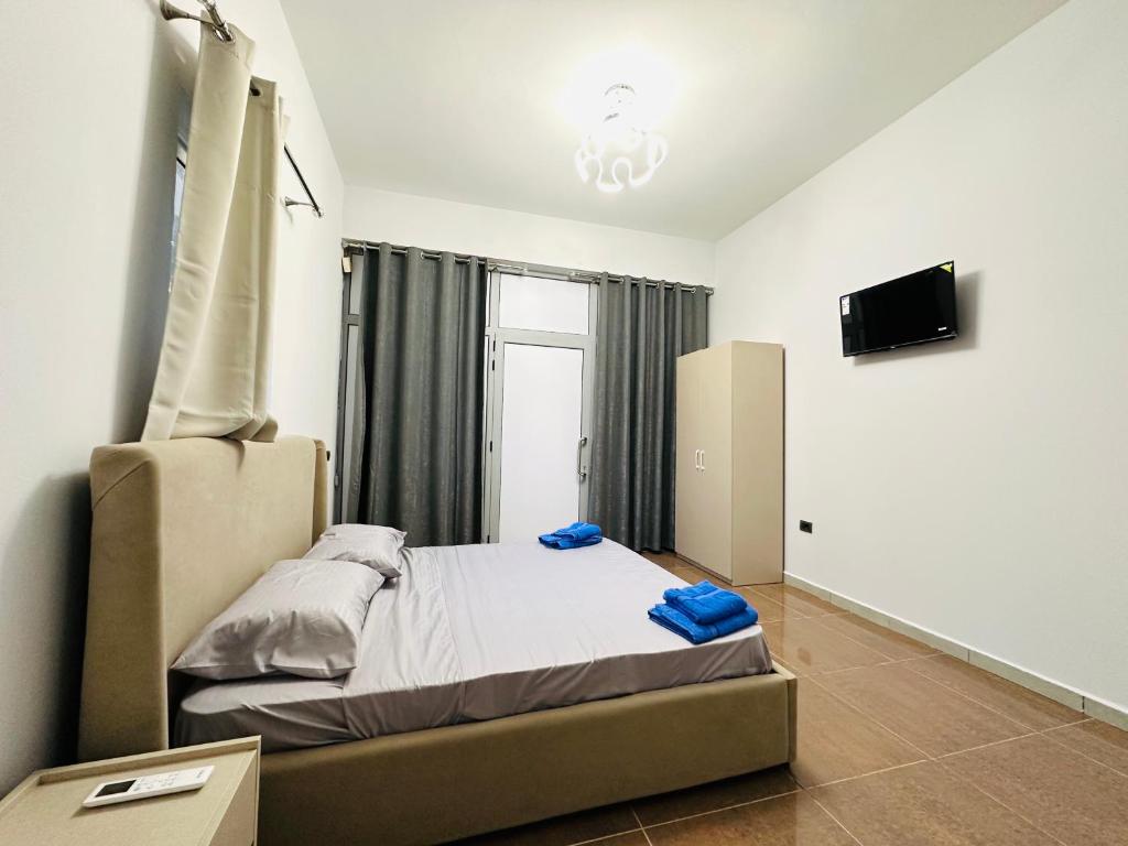 Postel nebo postele na pokoji v ubytování HOTEL SARDA