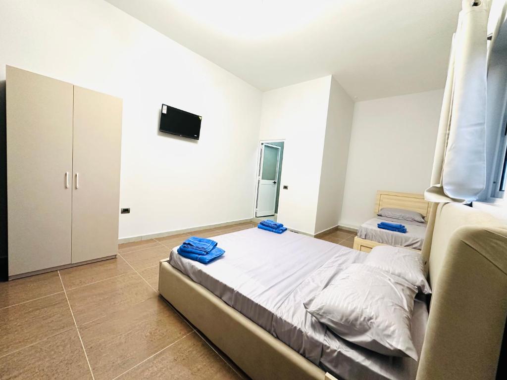 Postel nebo postele na pokoji v ubytování HOTEL SARDA