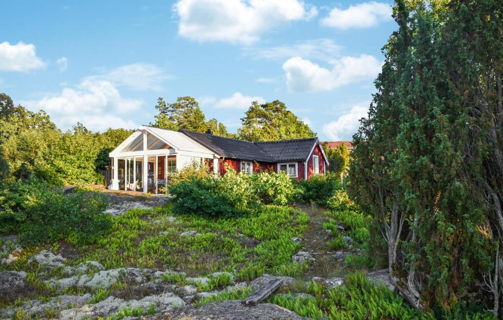 a house in the middle of a field at Nice Home In Ronneby With Wifi in Ronneby