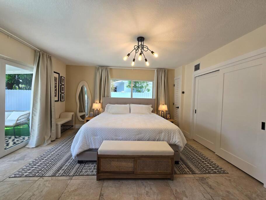 a bedroom with a large bed and a window at Palma Haus - Modern Villa with Pool Near the Beach in Hollywood Beach
