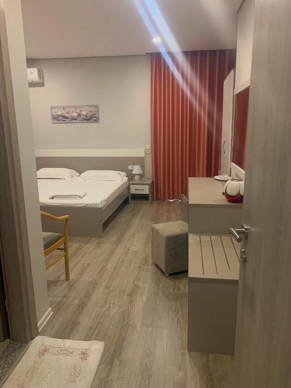 Postel nebo postele na pokoji v ubytování Star Hotel Saranda