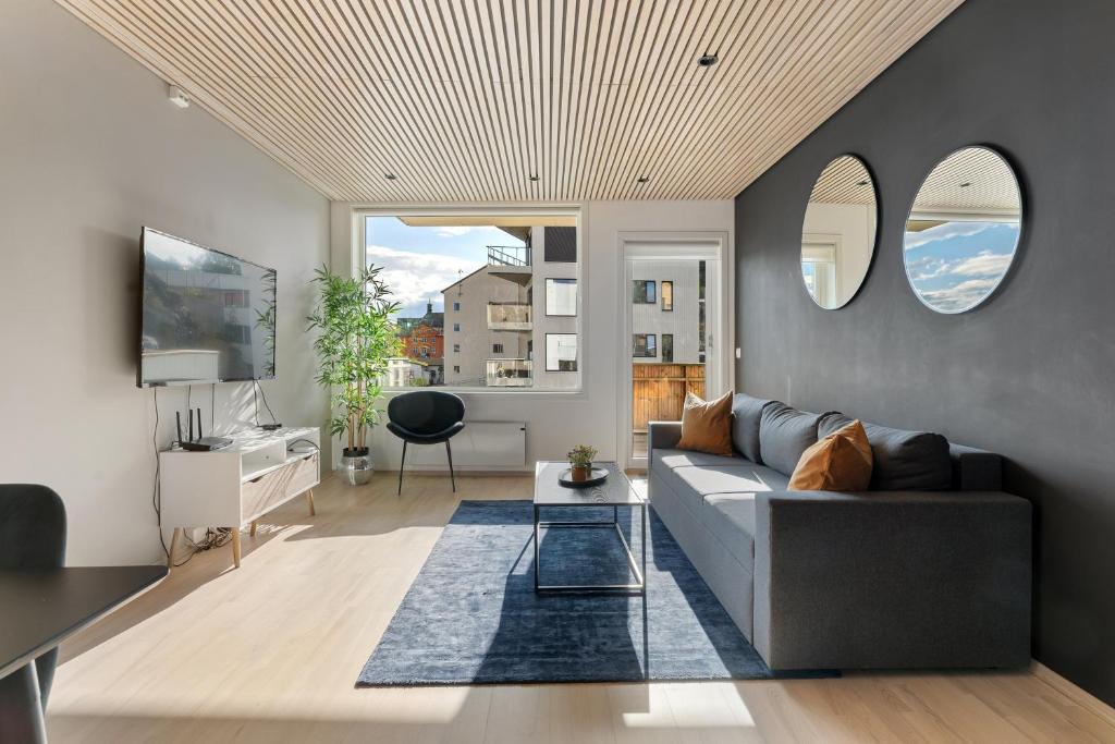 En TV eller et underholdningssystem på ARCTIC HOMES - Premium Aurora Apartment