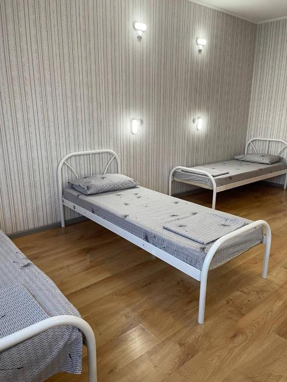Postel nebo postele na pokoji v ubytování VIP hostel