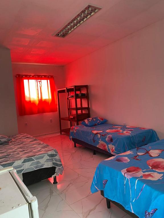 Voodi või voodid majutusasutuse Pousada Sol do Oriente toas